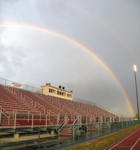 A double rainbow over Belleville West Stadium during a weather delay / Photo by Roger Starkey