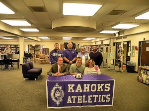 Tanner Houck signs a national letter of intent to play baseball at Missouri beginning in fall 2014. Front row, left to right, are Darrin Houck, (father) Tanner and Jennifer Houck (mother). Back row, left to right, are assistant coach Andy Sidwell, head coach Pete Trapp, Gwen Balen (grandmother) and assistant coach Dan Munoz / Photo by Roger Starkey