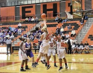 Gabby Morgan rises above Edwardsville defenders to take a shot on Jan. 14, 2014