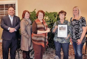 Members of Collinsville Progress present the Carl Schultze Improvement of the Month Award to members of the Collinsville Garden Club / Submitted Photo