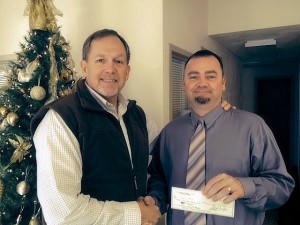 Collinsville Evening Lions Club President Mark Bryant presenting a check to John Griffith, Director of Student Services for Collinsville Unit 10 / Submitted Photo