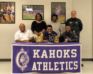 Josh Harris, with father Carl Edmunds left and grandfather Bernard Harris right. Standing, left to right, are April Edmunds, mother, Evelyn Edmunds, grandmother and John Blaylock, CHS head football coach / Photo by Roger Starkey