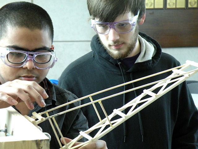 Collinsville High School students Kushan Patel (left) and Logan Hartley compete in the boomilever event at the Regional Science Olympiad on Feb. 15. - CHS-science-Kushan-Patel-Logan-Hartley