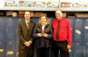 February Unit 10 Teacher of the Month Vicki Hunter. Rick Kincheloe, of Edward Jones, is to Hunter's right and Jefferson Elementary School Principal Dave Stroot is on Hunter's left