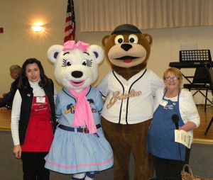 Left to right: Barb Kusmierczak of the Collinsville Junior Service Club, Lizzie the Grizzly, Izzy the Grizzly and Barb Smock of the Collinsville Women's Club at that 2014 Empty Bowl fundraiser / Photo by Roger Starkey