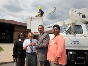 From left, Gussie Reed, Division V Director for Ameren Illinois, Caseyville Mayor Leonard Black, Ameren Illinois President and CEO Richard Mark, and Paula Nixon, Community Relations Coordinator for Ameren Illinois. In the bucket, is Ameren Illinois Lineman Mike Sapienza. Mark was presenting the keys to Mayor Black / Photo by Brian Bretsch