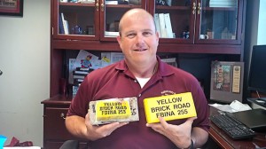 Collinsville Assistant Police Chief Tom Coppotelli displays his yellow brick from the FBI National Academy (left) and the one he received as a joke from colleagues when a partial government shutdown ended his first trip to the academy after only one week / Photo by Roger Starkey