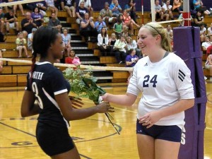 Gabby Hancher giving rose to Brandi Stevenson